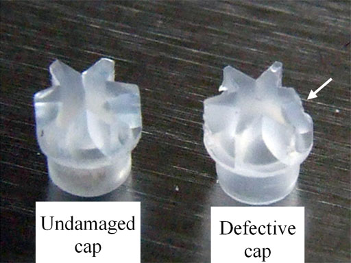 Damaged cap